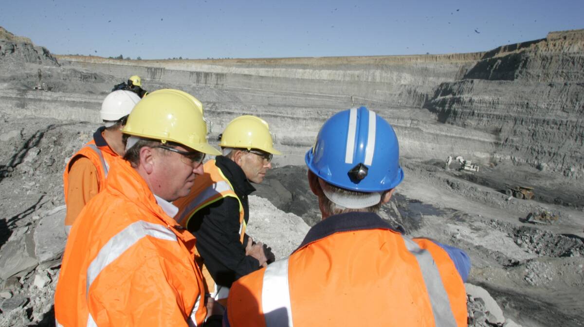 Visit: Tony Abbott with workers at the Wambo mine site in 2011.