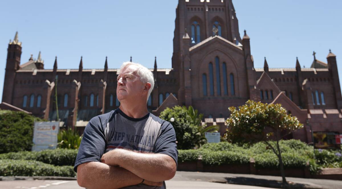 Healing: Steve Smith outside Newcastle's Anglican Christ Church Cathedral. He used to be terrified of the building because of child sexual abuse by an Anglican priest. Picture: Simone De Peak. 