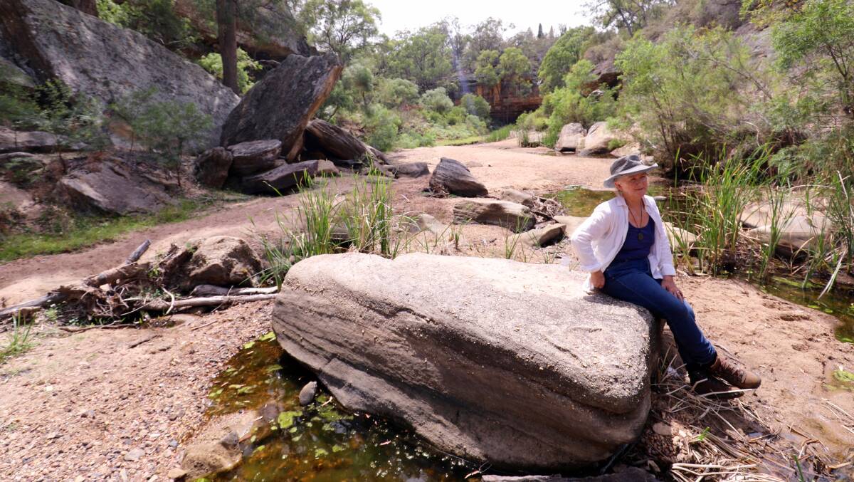 Warning: Julia Imrie in the dry bed of the Goulburn River. A Federal Government assessment has confirmed residents' long-held concerns about mining-related water impacts. 