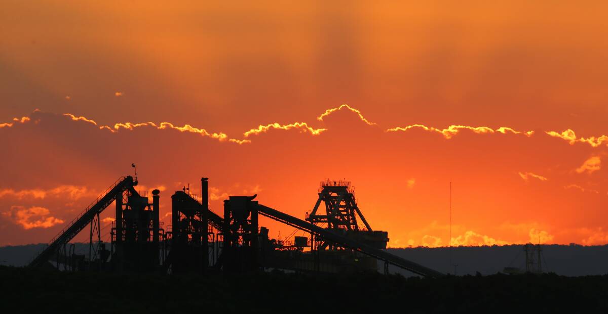 Future: Sunset over coal loading facilities at Kooragang. Picture: Max Mason-Hubers.
