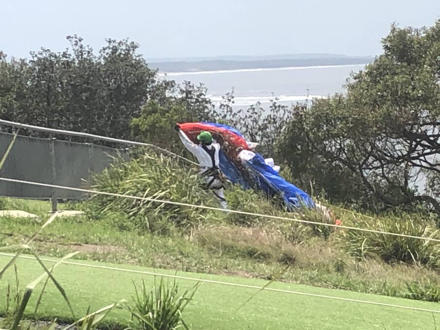Rescue: Rescuers retrieve the man's parachute.