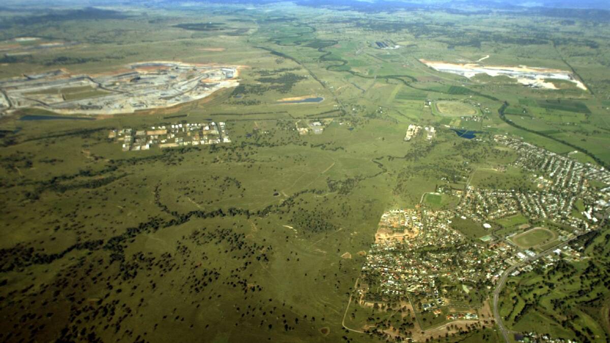 History: A 2005 aerial shot showing Muswellbrook town (right bottom) with Mount Arthur at top left. The massive mine has expanded its footprint near the town.