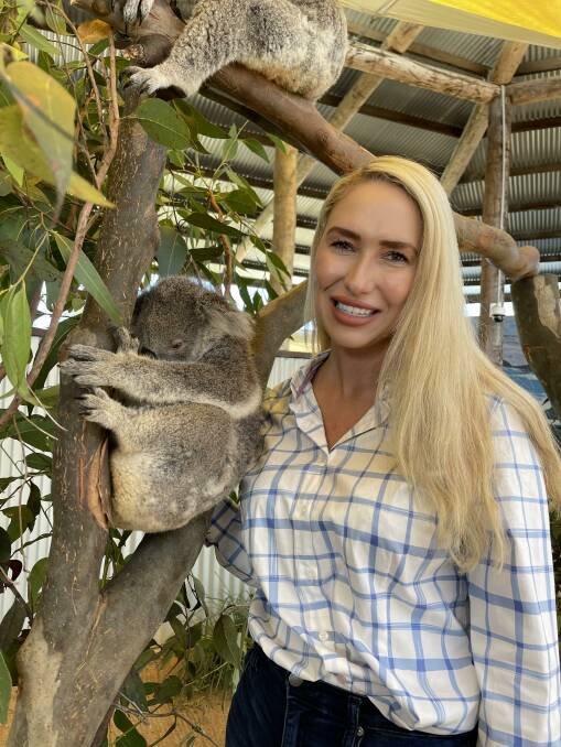 Federal Liberal candidate for Paterson Brooke Vitnell with a koala. 