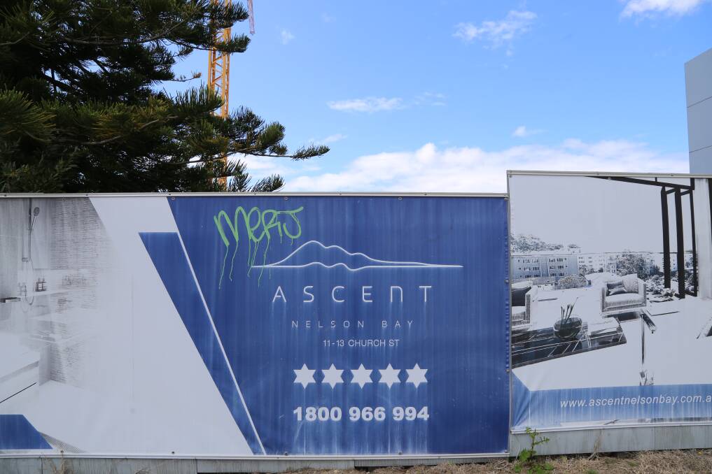 So long has the signage advertising the Ascent apartments been up in Church Street now that it has faded in the weather and been graffitied. 