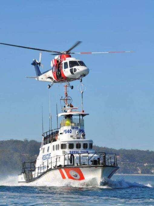 PS40 Danial Thain, which was sold to ECA Maritime College in 2017, on a training run with the RAAF-contracted Air/Sea Rescue helicopter, CHC Helicopters when it was still in commission. Picture: Supplied