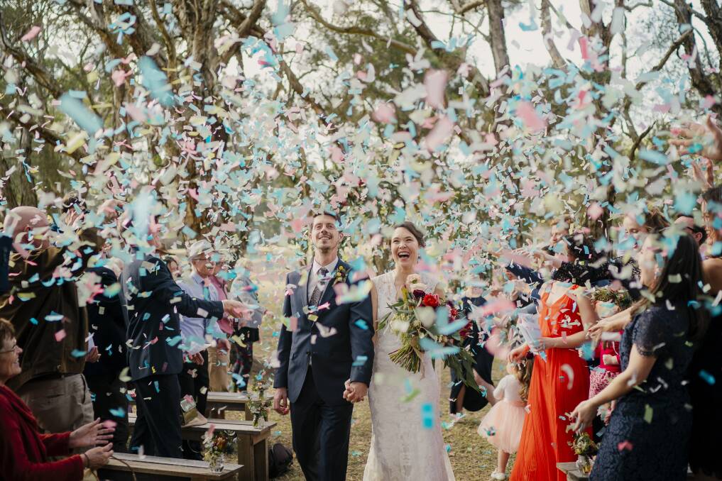 BEAUTIFUL: Newcastle wedding photographer Ben Howland's image Showered With Love, showing Matt and Anna being covered in confetti, took out the wedding category of the 2019 Sony Alpha Awards. Picture: Ben Howland