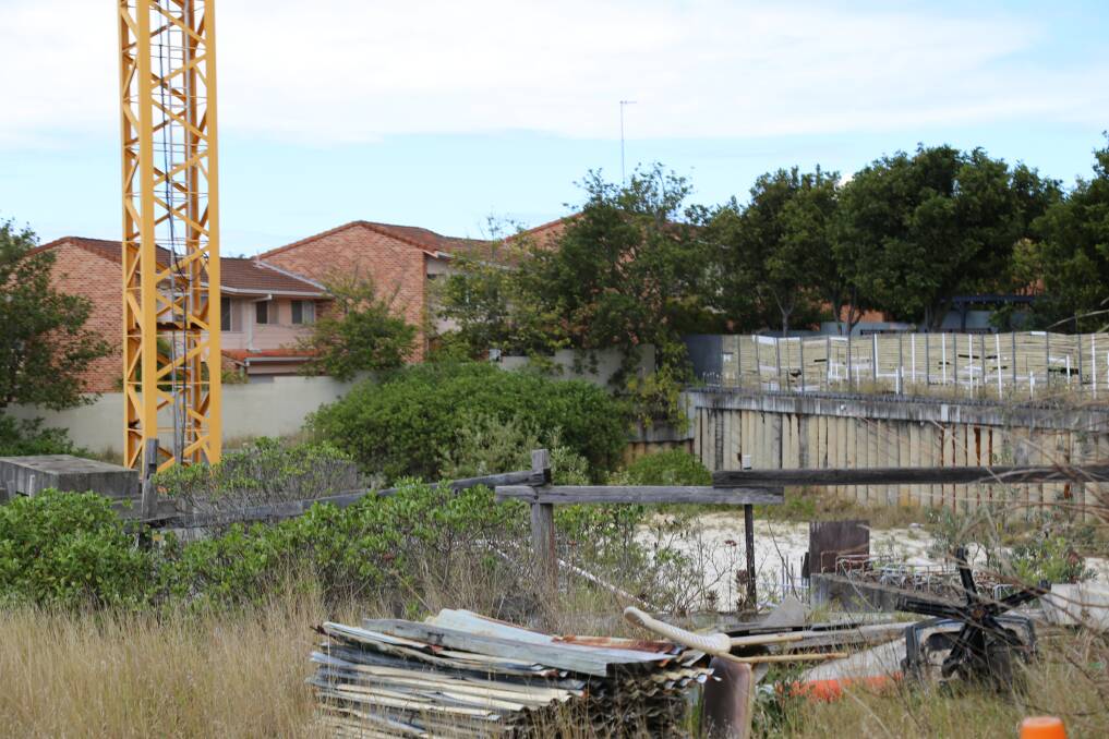 COHO Property has owned the Ascent Nelson Bay site, pictured, since 2014. The land in Church Street has undergone earthworks since then, but development of the 11-storey apartment building has stalled. 