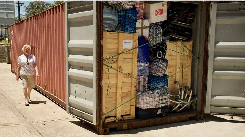 Erica Henley with the first packed shipping container, which was shipped to Kurdistan in 2018. Picture: Operation Hope Australia