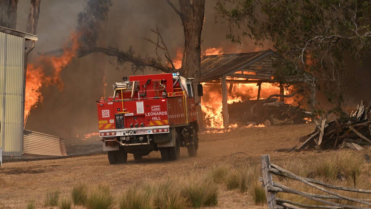 Firefighters responding to a blaze at Buangor in western Victoria. Picture by Lachlan Bence