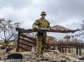 An Army officer helps during Operation Bushfire Assist. Picture Defence Images
