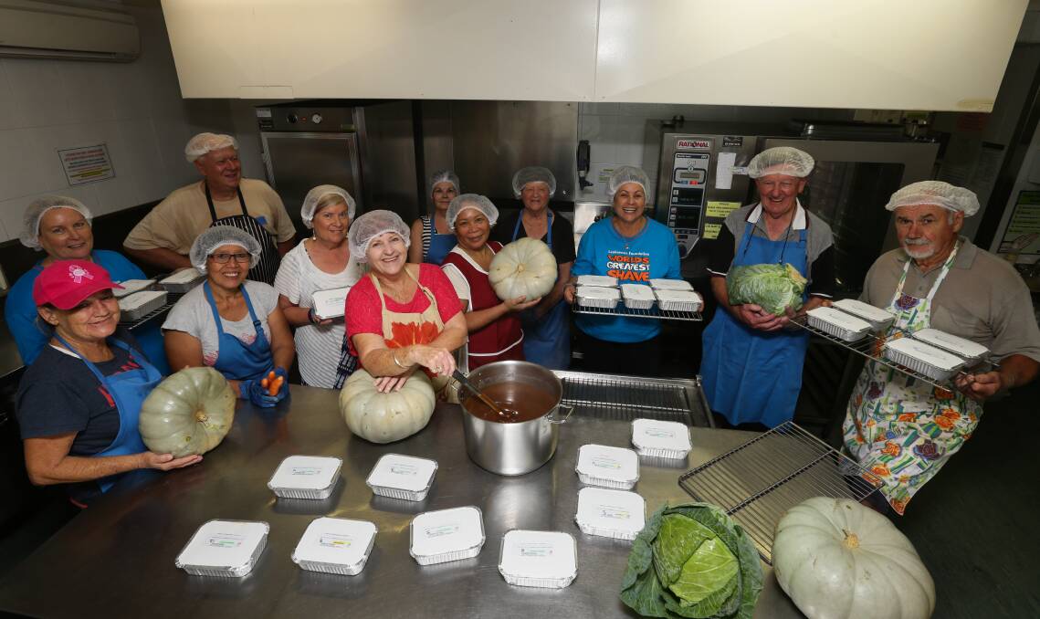 READY TO GO: Charlestown volunteers preparing their deliveries at their James Street kitchen. Picture: Jonathan Carroll