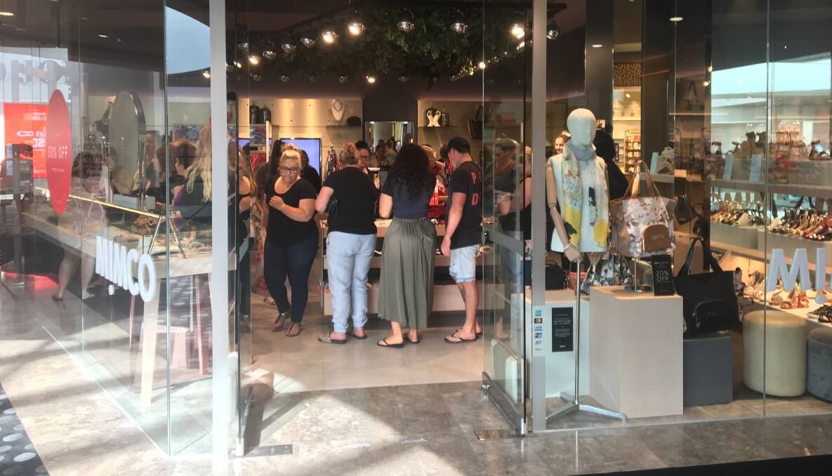 Shoppers at Charlestown Square and Kotara Westfield before 8.30am on Wednesday morning. Pictures: SUPPLIED