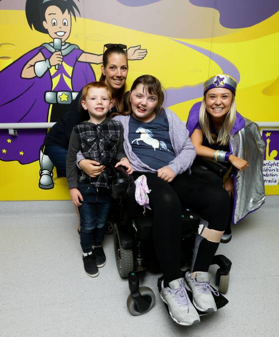 ROOM TO PLAY: Emily Chesson and her five-year-old brother Mason Green, mother Shahn Green and Captain Starlight at John Hunter Children's Hospital. Picture: Jonathan Carroll