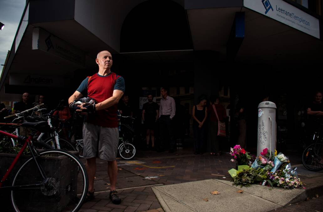 MISSED: Cyclist Vic Mordue pays his tribute to Brigitte Nilsen who he knew as a regular to Newcastle Regional Library. Picture: Simon McCarthy 