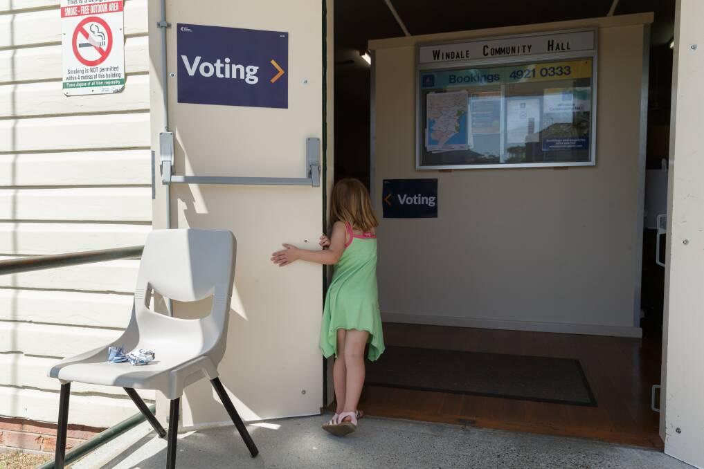MYSTERY: Elliot, 5, the daughter of Lisa Parkes at Windale Community Hall polling booth. Picture: Max Mason-Hubers