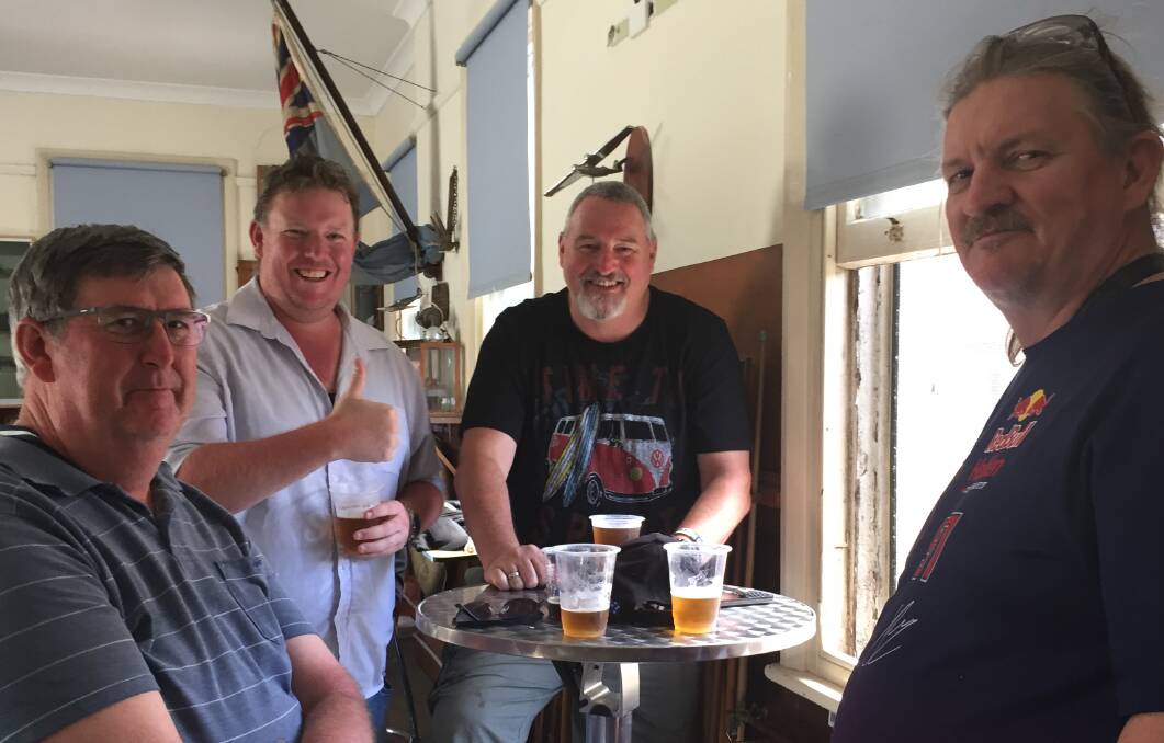 WORD OF MOUTH: Geoff Neighbour (second from right) enjoying the United Service Club's view over the tracks with friends. Picture: PHOEBE MOLONEY