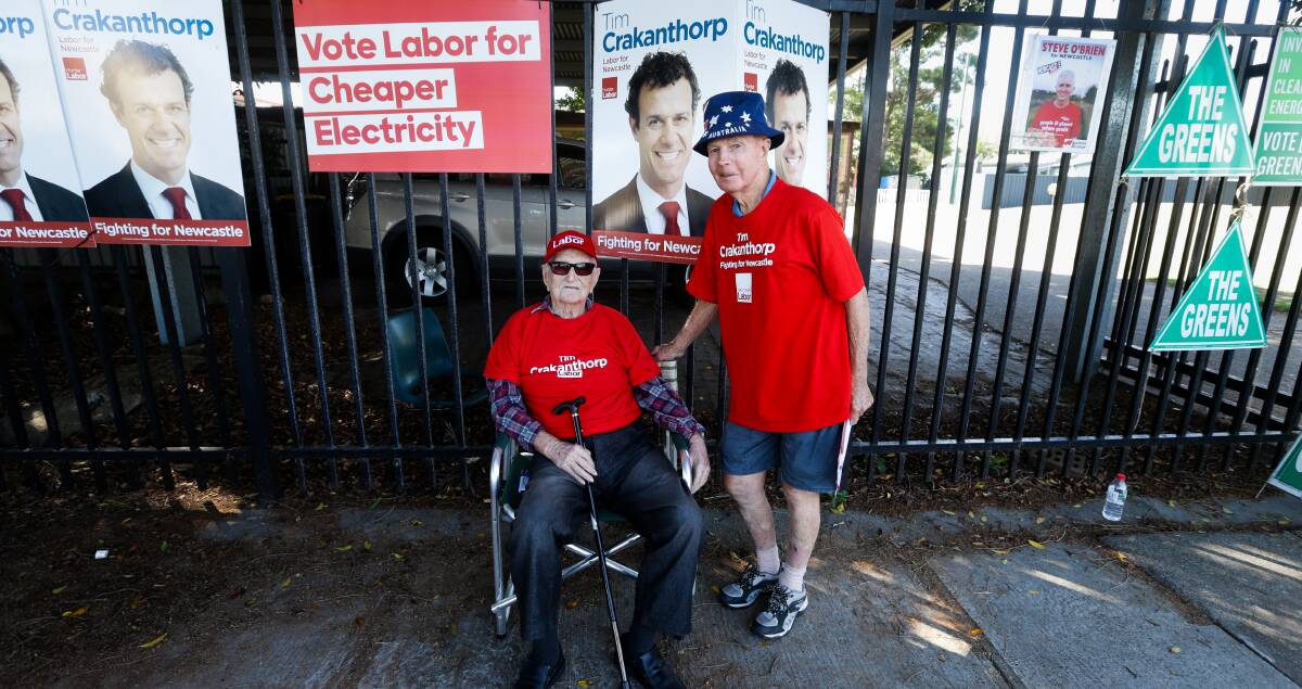 BOOTH BOSS: Donald Roser and Neil Pitt campaigning for Labor at Carrington Public School on Saturday. Picture: Jonathan Carroll 