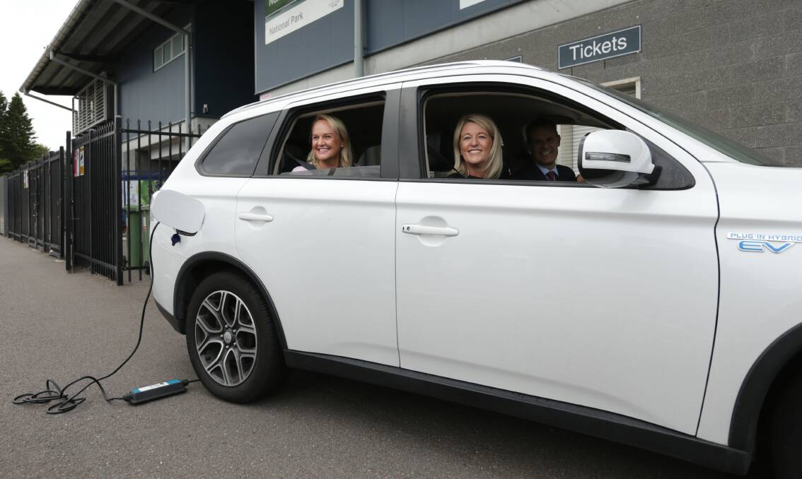ON BOARD: State member for Newcastle Tim Crakanthorp, Newcastle mayor Nuatali Nelmes and Labor innovation spokesperson MP Yasmin Catley try out an electric car. Picture: Simone De Peak