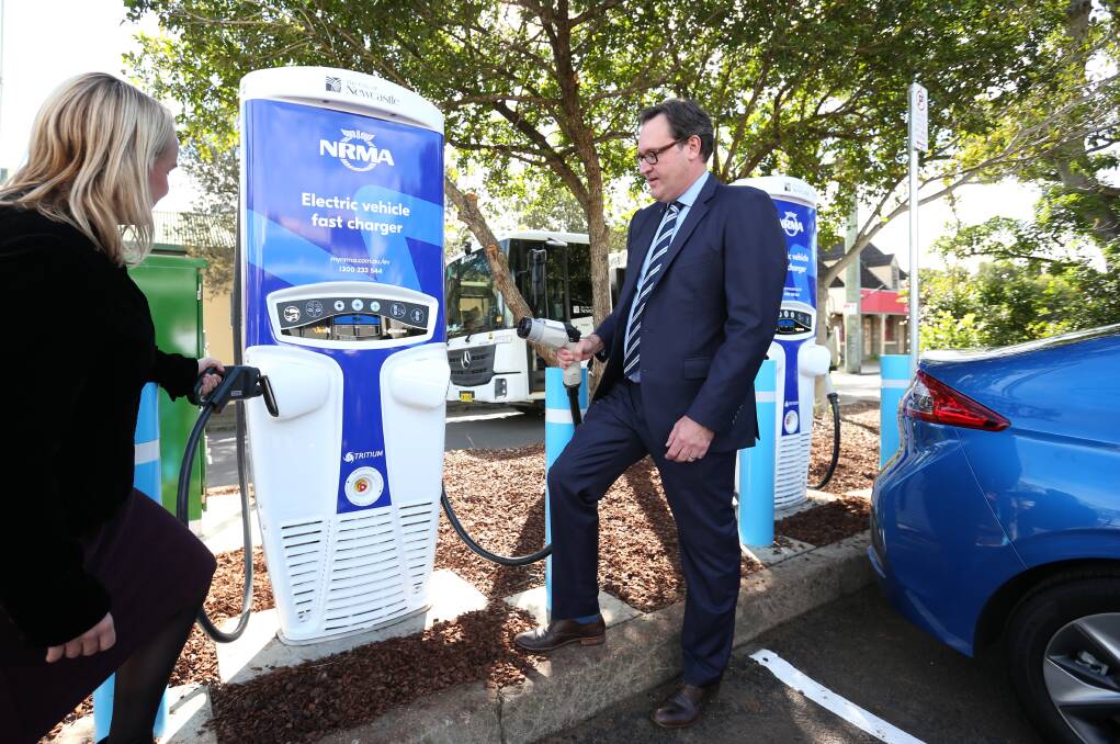 OUTLET: Newcastle mayor Nuatali Nelmes with NRMA chief financial officer Michael Gabriel at the charging outlet installed in Wallsend in June 2018. Picture: Simone De Peak