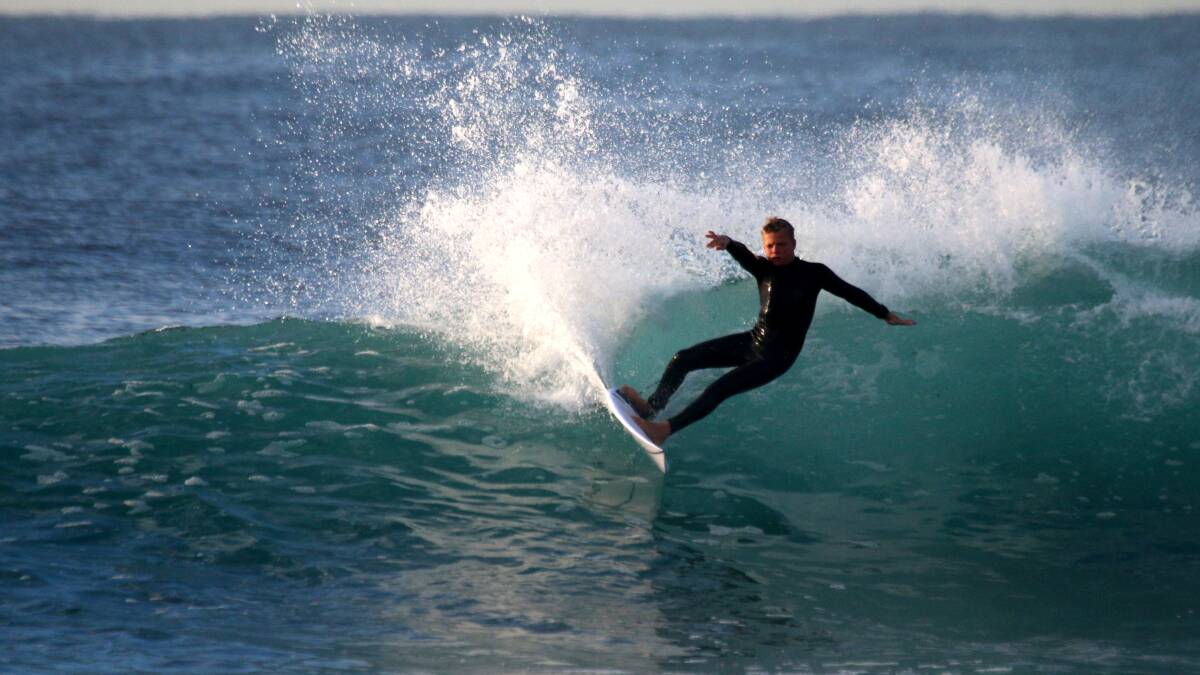 SPRAY: Zac Tinson surfing on Tuesday. Picture: Dave Anderson