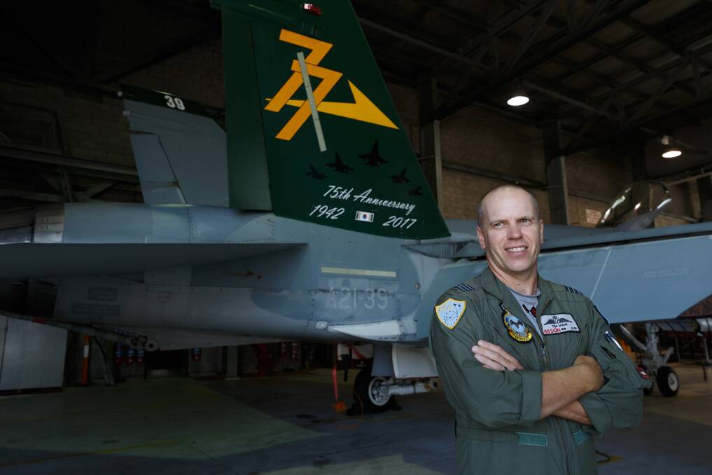 TAKE OFF: Wing Commander Tim Main, commanding officer of 88 Squadron, with a Hornet at the launch of Exercise Diamond Shield. Picture: Max Mason-Hubers