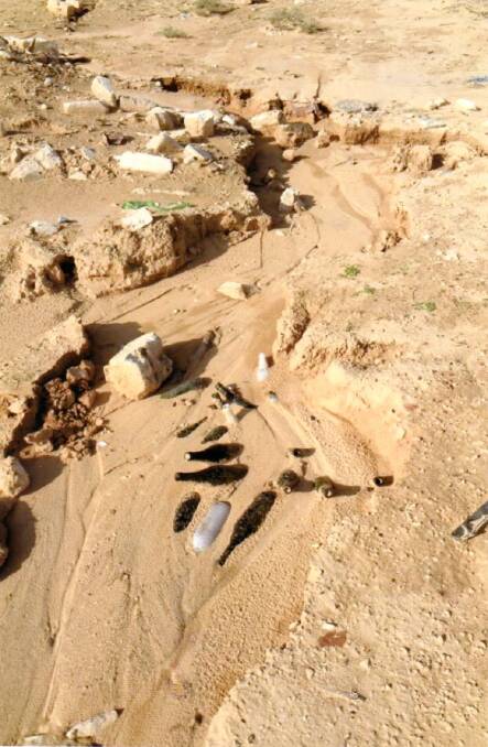 SANDS OF TIME: Bottles uncovered by locals at Mersa Matruh after Mr Brown's son, Robert, and grandson, Chris, told them Mr Brown's story. Picture: Supplied