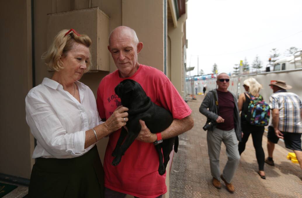 Keran and Roger Davis with Denni the dog, who live near the Supercars track. Picture: Simone De Peak