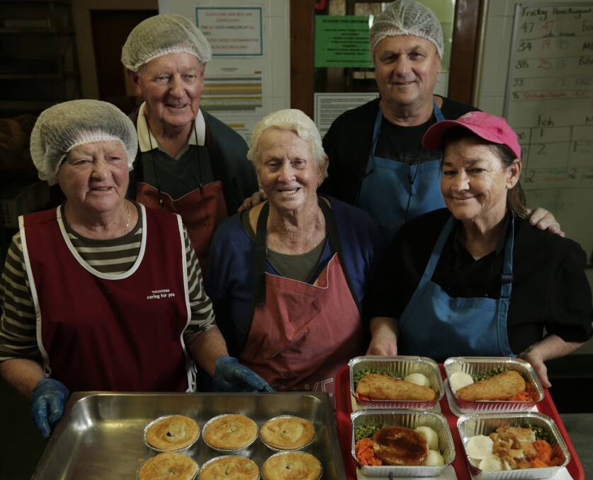SERVING UP: Volunteers Jan and Stan Shephard, Kay Gardner, Dennis Tawan and kitchen supervisor Celia Deaves. Picture: Simone De Peak 