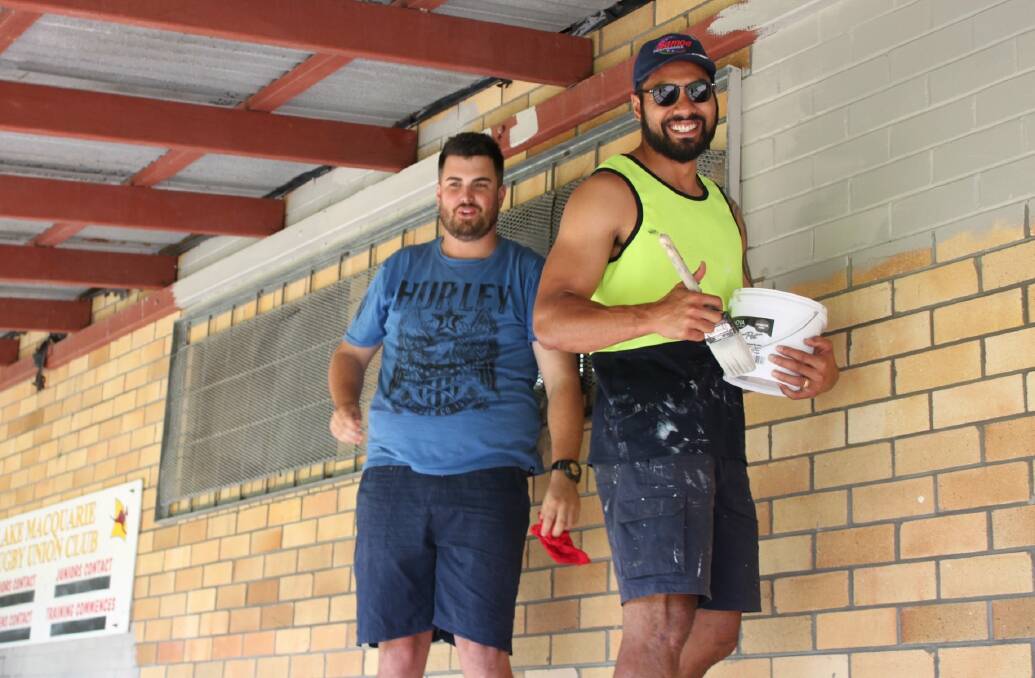 A MONTH OF MAKEOVERS: CityServe volunteers apply a fresh paint job to Lake Macquarie Rugby Club's dressing rooms in Walters Park, Boolaroo, on the weekend. 