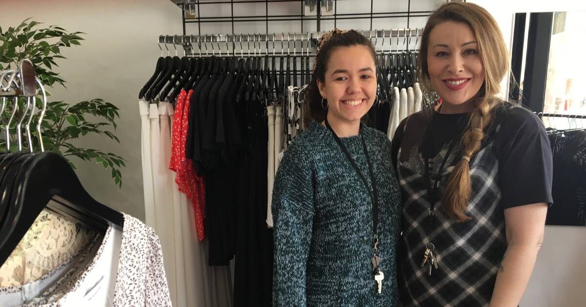 BUSY: Shop assistant Micaela Phillips and owner Kristen Pridmore of Kiki Fashion on Hunter Street. Picture: Phoebe Moloney