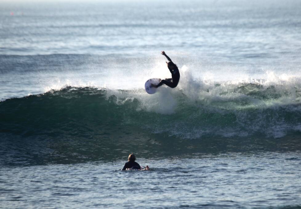 REACH: Jesse Adam up high at Merewether. Picture: Dave Anderson