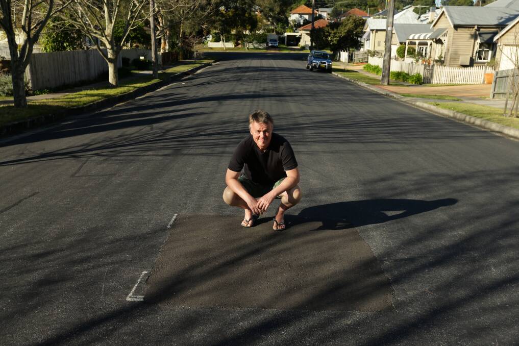 UNDER THE ROAD: Walter Koch, of Wallsend, says after two attempts he was told the water pipe would have to be cut under the road to disconnnect his service. Picture: Jonathan Caroll 