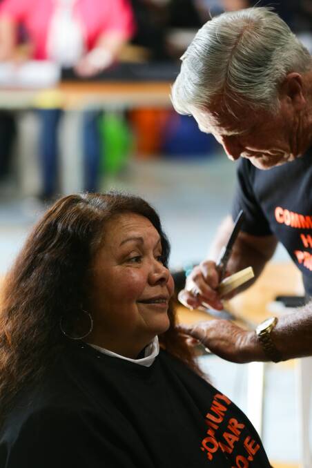 GLAMOUR: Hairdresser Ron Harman cuts Melissa McDonnell's hair. Picture: Jonathan Carroll 
