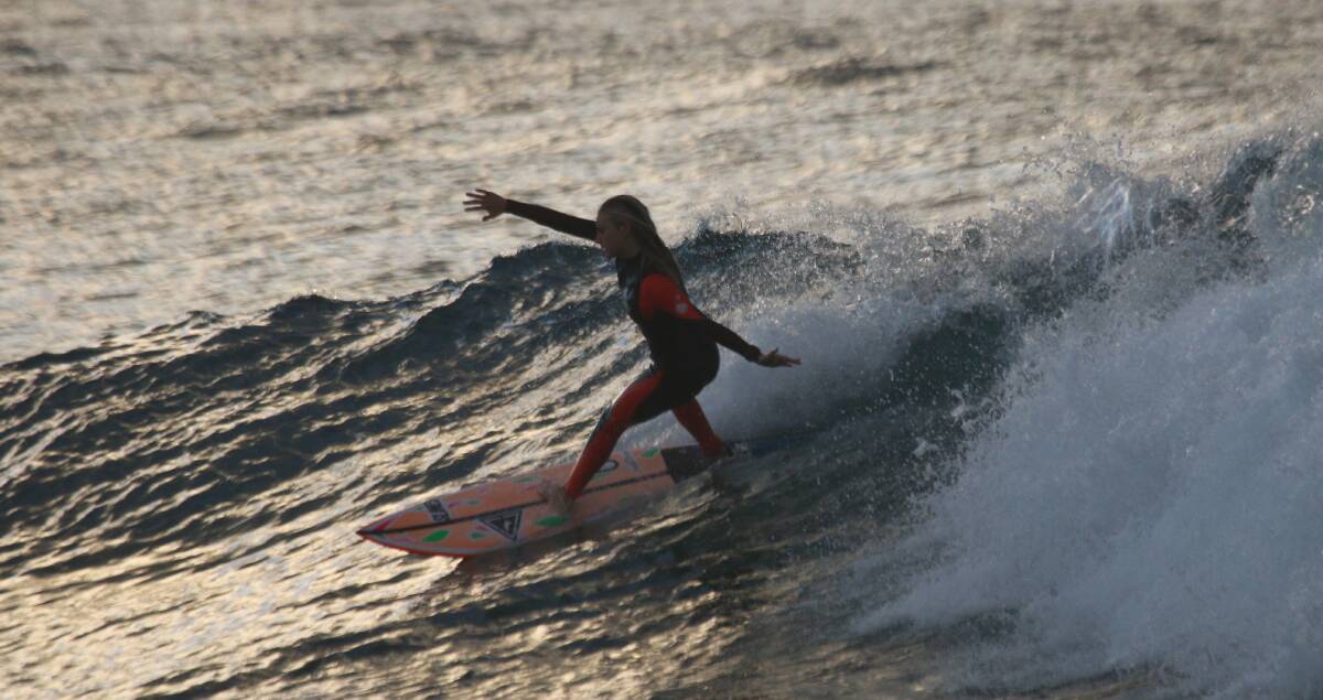 ON BOARD: Elle Lambkin getting out in the surf in preparation for an upcoming contest. Picture: Dave Anderson