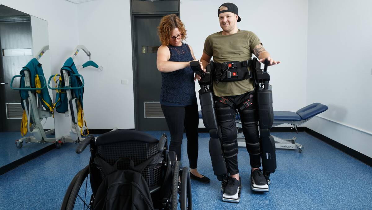 STEP FORWARD: PhD student Nicola Postol with Ashley Treseder using the Hunter's Exoskeleton for Lower Limb Exercise and Neuro-rehabilitation. Picture: Max Mason-Hubers 