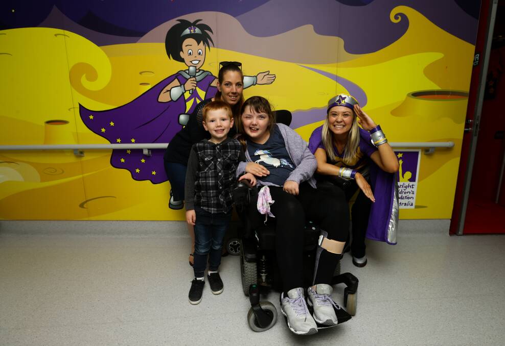 ROOM TO PLAY: Emily Chesson and her five-year-old brother Mason Green, mother Shahn Green and Captain Starlight at John Hunter Children's Hospital. Picture: Jonathan Carroll