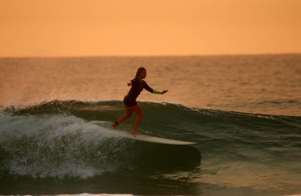 COOL: A surfer hits the waves on Thursday. Picture: Dave Anderson