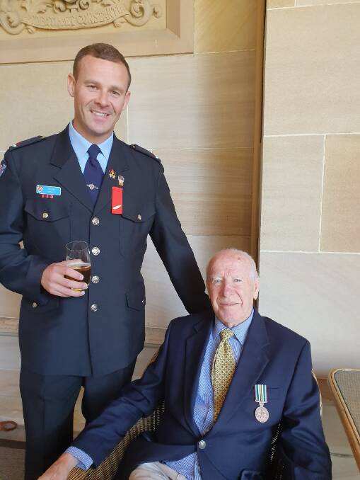 AWARDED: Ben Swift with his grandfather Brian Swift after the investiture ceremony in Sydney. Picture: Supplied