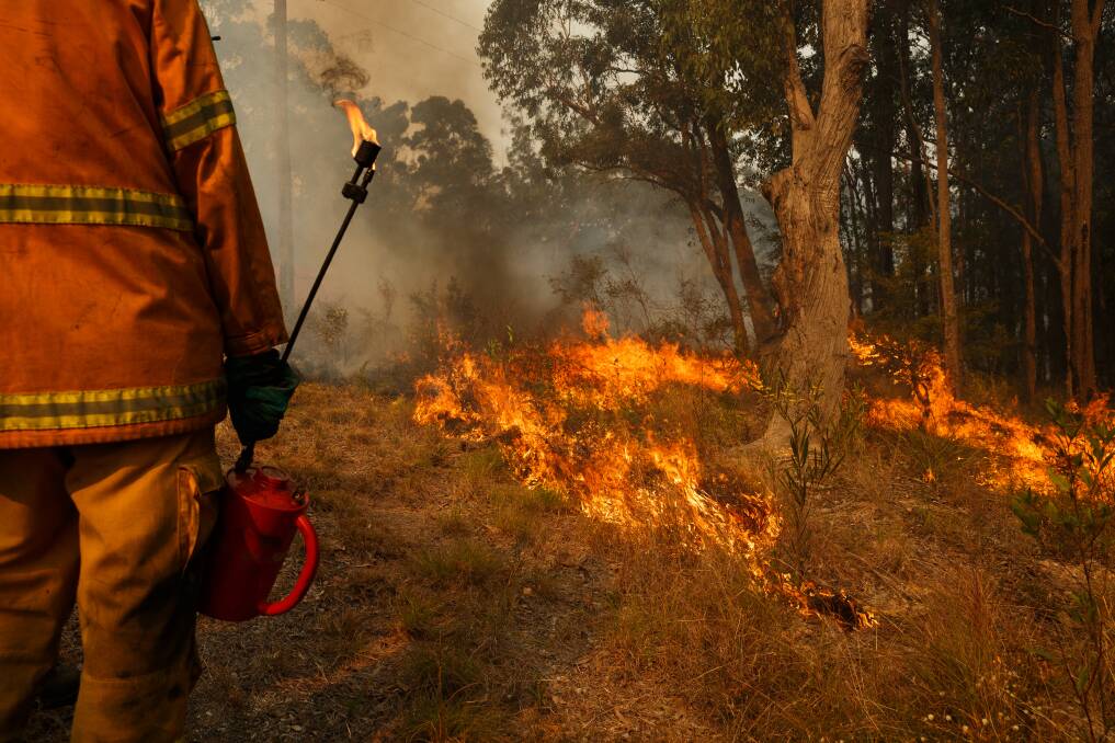 Cooranbong RFS fire fighters conducting a hazard reduction burn in 2018. Picture: Max Mason-Hubers