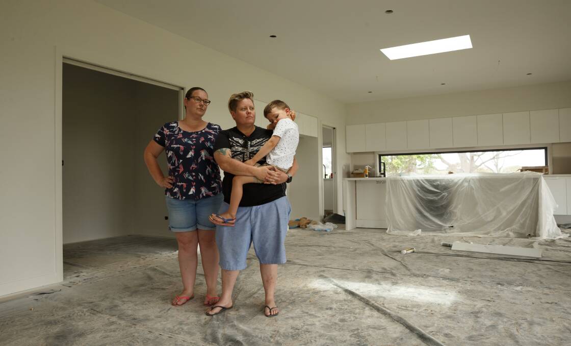 LIMBO: Ruth Larkin, Amie Wilson and their son Theodore, 4, are stuck in limbo after the construction company building their home went into liquidation.