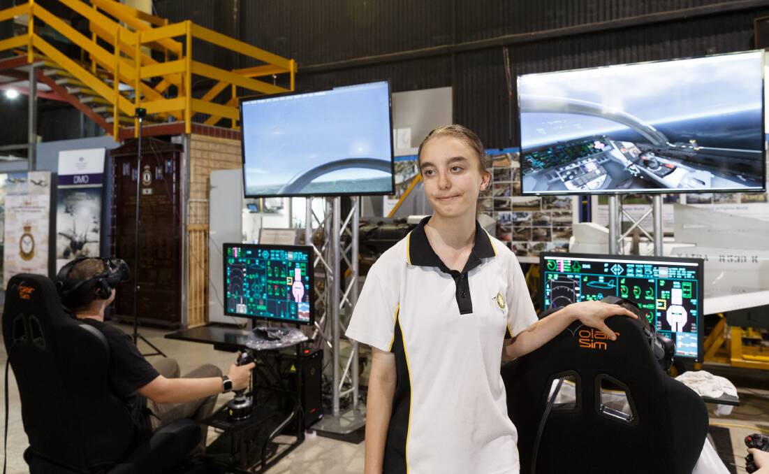 DREAMS: Lavendel Seguin, a Year 9 students at San Clemente High School, with an F-35 flight simulator in the background. She hopes to become a pilot. Picture: Max Mason-Hubers 