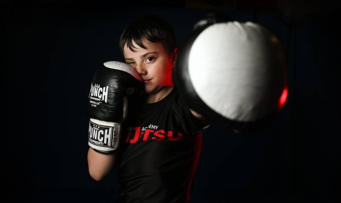FIGHTER: Kane Ransom, eight, during Brazilian Jiu Jitsu training. He is currently undergoing chemotherapy for leukemia. Picture: Marina Neil