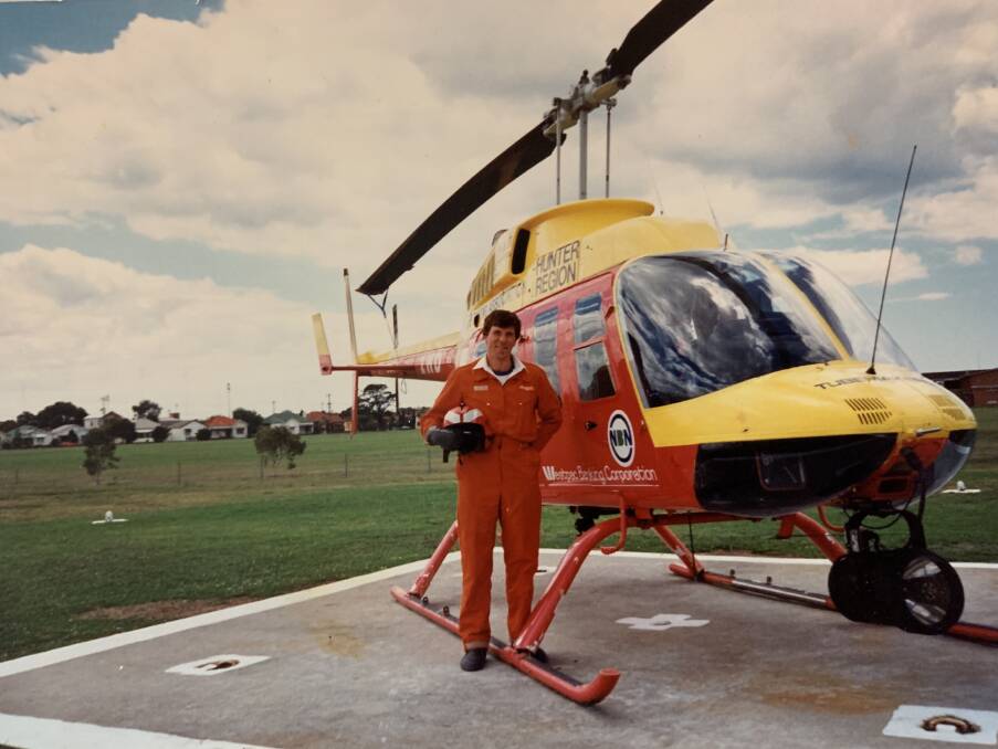 EARLY DAYS: Mr Cook with a former rescue helicopter. Picture: Supplied.