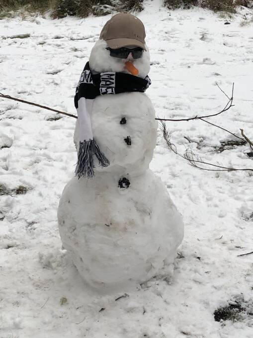 SNOW WORRIES: A snowman chills out at Barrington Tops on Sunday. Picture: Jonathon Koop-Folkes