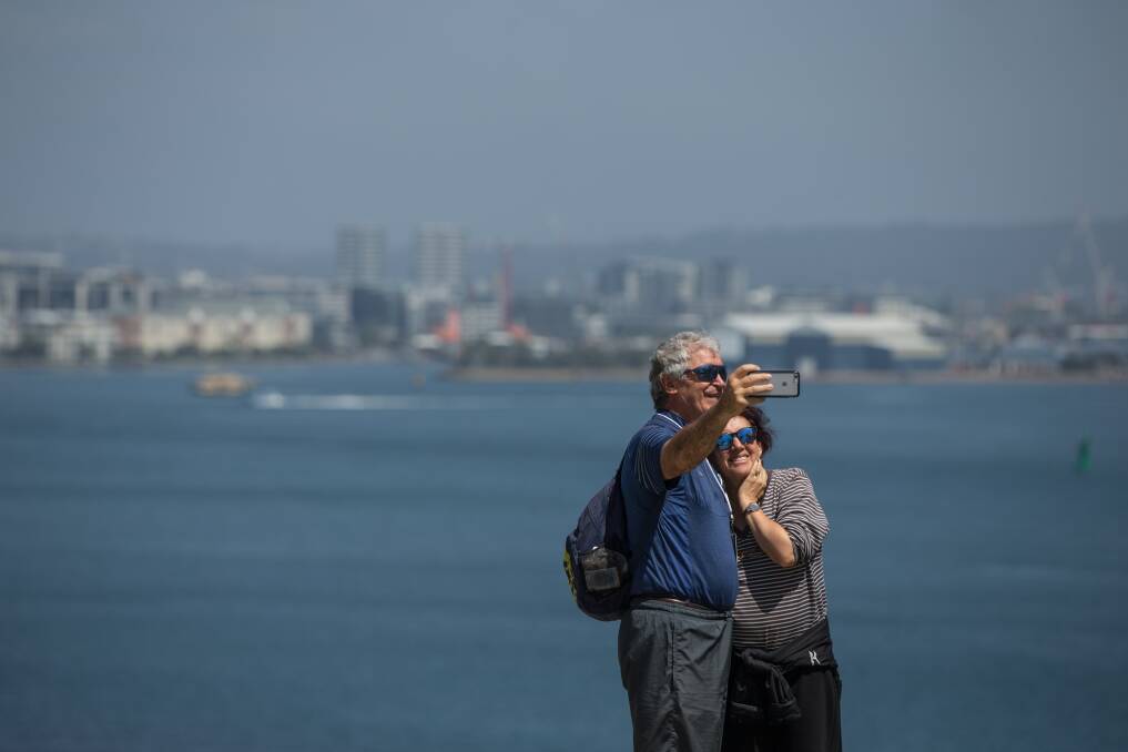 Celebrity Solstice passengers from Sydney Bruno and Luba Pase take a selfie at Nobbys headland. Picture: Marina Neil