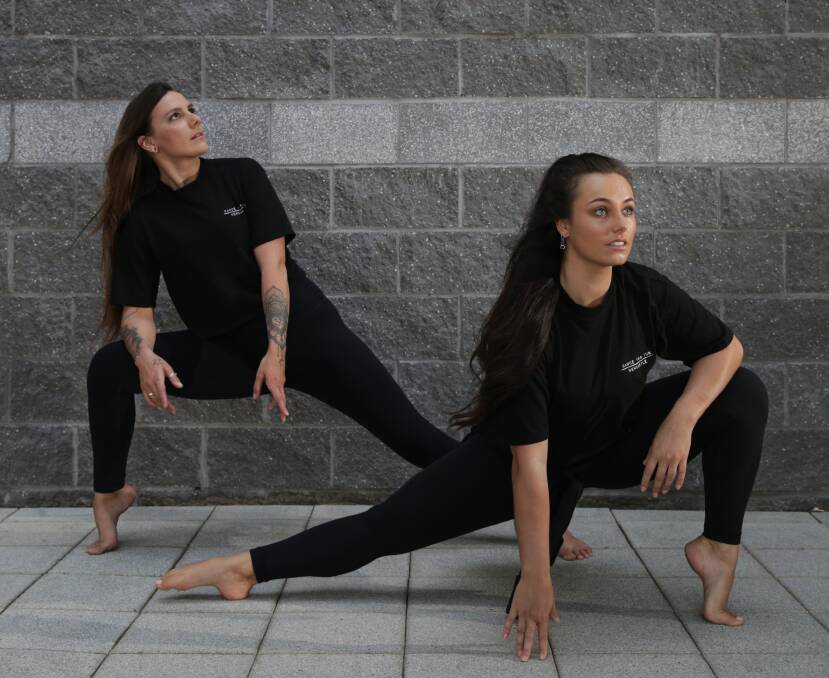 DANCE: Dancer Brigitta Willis with owner of Dance for Fun Newcastle, Kahli Saunders, who will be performing in a showcase of students raising money for Beyond Blue and animal charity Where Pigs Fly. Picture: Simone De Peak
