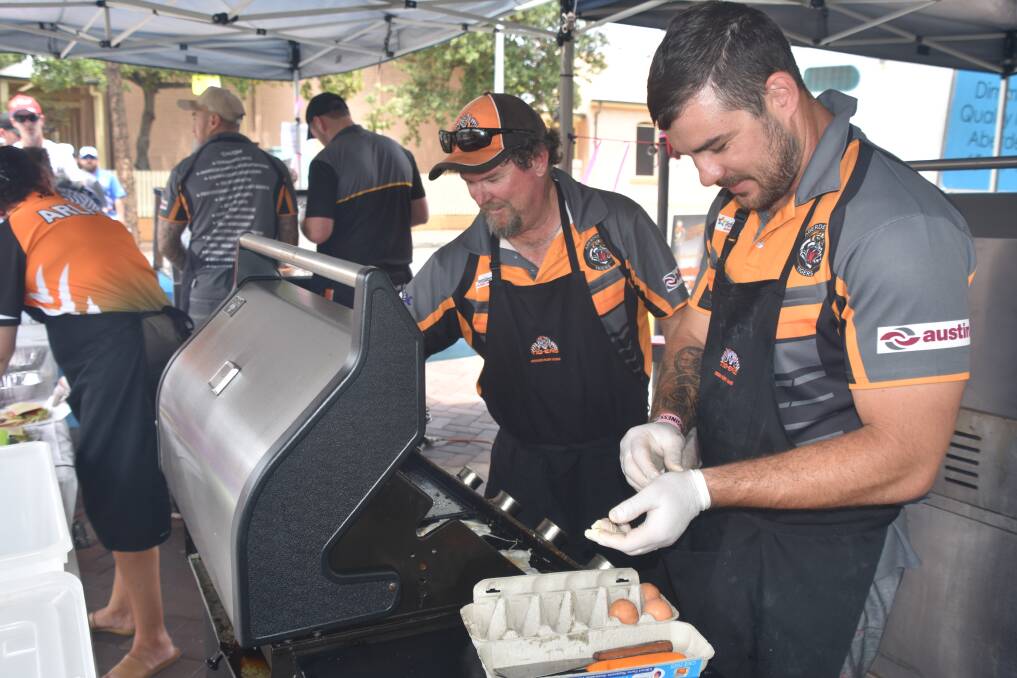 FUNDRAISER: Aberdeen Tigers rugby league club players host a barbecue outside cafe 23Hundred. Picture: Max McKinney 