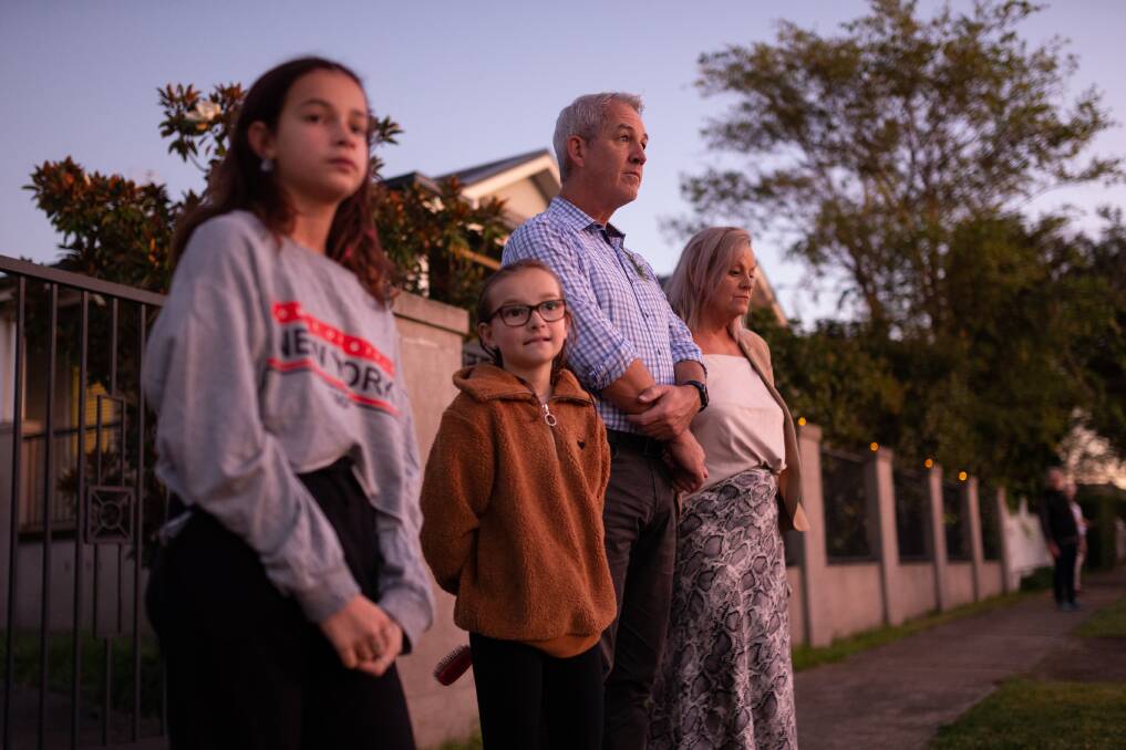 FAMILY: Amanda Mock and her partner Darrin Carter and children Jasmine, 12, and Dimity, 10, outside their home on Saturday morning. Picture: Max Mason-Hubers