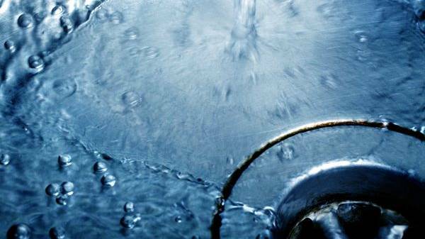 Hamilton water outage gushing water onto road