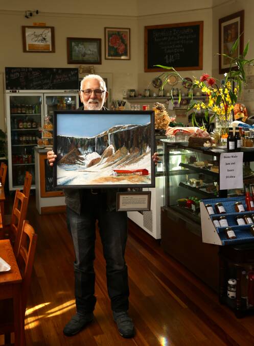 LOCAL CHAMPION: Kurri Kurri's Col Maybury in 2019 with one of his late wife Marcia's paintings. Picture: Johnathan Carroll